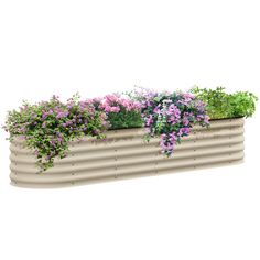 a planter filled with lots of flowers on top of a white wall