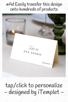 an image of a table with place cards on it and candles in the back ground