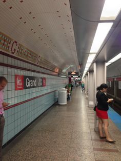 people are standing in line at the subway station