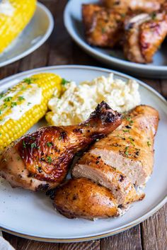 the best grilled chicken marinade is served on a plate with corn and mashed potatoes