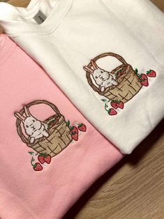 Introducing our Strawberry Basket Bunny Embroidered Sweatshirt 2D Crewneck Sweatshirt, a delightful and charming addition to your wardrobe. Designed for both men and women, this sweatshirt is a perfect blend of comfort, style, and versatility. At first glance, the detailed embroidery of a cute bunny nestled in a basket of fresh strawberries catches your eye. The intricate stitching brings the design to life, adding a touch of playfulness to your outfit. Made with precision and care, this embroid Cute Cotton Sweatshirt With Custom Embroidery, Cute Cotton Sweatshirt With Embroidered Graphics, Cute Cotton Sweatshirt With Embroidered Logo, Cute Embroidered Long Sleeve Sweatshirt, Cute Custom Embroidered Crew Neck Hoodie, Cute Long Sleeve Embroidered Sweatshirt, Cute Hoodie With Custom Embroidery And Crew Neck, Cute Cotton Sweater With Embroidered Logo, Cute Cotton Crew Sweatshirt