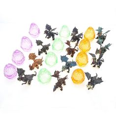 a bunch of toys that are on a white surface with one toy in the middle