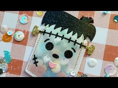 a close up of a cell phone case on a table with buttons and other items