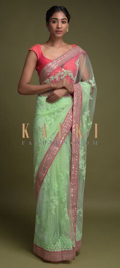 Buy Online from the link below. We ship worldwide (Free Shipping over US$100)  Click Anywhere to Tag  Pista Green Saree In Net With Applique, Thread And Sequins Embroidered Floral Pattern Online - Kalki Fashion  Pista green saree in net with applique, thread and sequins embroidered floral pattern.It comes with a pink border enhanced with zari and sequins work. Traditional Pista Green Saree With Floral Embroidery, Festive Pista Green Saree With Floral Embroidery, Pista Green Saree With Intricate Embroidery, Pista Green Saree With Floral Embroidery, Pista Green Embroidered Saree Fabric, Pista Green Saree, Net Sarees, Pista Green, Latest Indian Saree