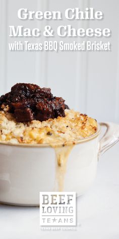 green chile mac and cheese with texas bbq smoked brisket in a white casserole dish