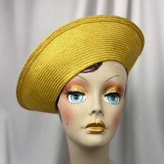 A new look for every day in this fantastic parasisal straw travel hat. The weight of the straw and the tension the weaver used when making the base for this hat give it the flexibility to have several different looks. What's more it will fold flat for your carry on. The color here is mustard. The crown measures 9 " across and the brim about 3.5. The head size is stretchy and will fit 22" - 23" - maybe a bit more. A tie is included so you can snug it up a bit if you like. Protect your hats from t Yellow Wide Brim Straw Hat In Toquilla Straw, Yellow Wide Brim Toquilla Straw Hat, Yellow Straw Hat With Curved Brim, Vintage Yellow Brimmed Sun Hat, Vintage Yellow Sun Hat With Curved Brim, Yellow Straw Hat With Wide Brim, Yellow Straw Hat With Short Brim, Yellow Straw Sun Hat With Short Brim, Yellow Wide Brim Straw Hat