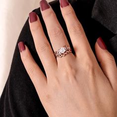 a woman's hand with a ring on it