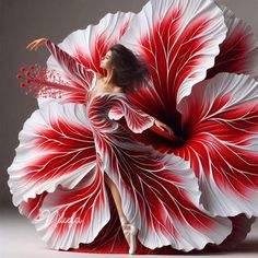 a woman in a red and white dress is dancing