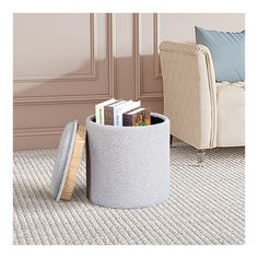 a living room scene with focus on the flooring and books in the storage bin