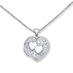 This darling heart-shaped locket necklace for her is decorated with two hearts and a scrollwork design. The sterling silver pendant sways from an 18-inch cable chain that fastens with a spring ring clasp. Double Heart Locket Necklace In White Gold, Double Heart White Gold Locket Necklace, White Gold Double Heart Locket Necklace, Engraved Double Heart Locket Necklace In White Gold, Sterling Silver Locket Necklace, Heart Shaped Jewelry, Heart Locket Necklace, Ashes Jewelry, Necklace For Her