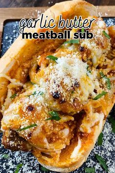 an open faced meatball sub with parmesan cheese