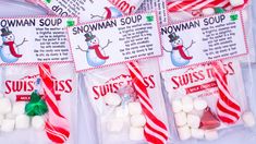 candy bags filled with snowman soup and marshmallows in red and white stripes