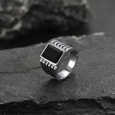 It is believed that onyx is a protective stone worn when facing adversaries. Based on folklore, onyx brings increased vigor, strength, stamina, and self-control. The masculine style black onyx ring enriches with engraved stripes on the ring sides makes the onyx band ring more noticeable. Faithheart onyx ring for men is crowned with a large flat-top rounded square-shaped black onyx stone which is classic and easy to match with any outfit.   SPU:  TR60094  Collection:  Stone  Material：Stainless St Black Onyx Ring Men, Onyx Ring Men, Nordic Vikings, Masculine Style, Viking Symbols, Rounded Square, Norse Vikings, Stone Material, Black Onyx Stone