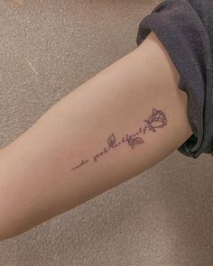 a woman's arm with a tattoo on it