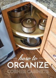 an organized corner cabinet with pots and pans