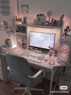 a desk with a computer on top of it in a room filled with toys and decorations