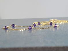 This delicate handmade necklace features 7 genuine Purple Amethyst Gemstones wrapped in 14k Gold Filled or Sterling Silver made in the length of your choice. This dainty beaded necklace is easy to wear alone or layered with other necklaces. A classic and simple everyday piece that will make fashion look effortless. Customize yours by choosing your metal and length. This necklace design is also available in different gemstones. Makes a great gift to add to any gemstone lover's collection. Perfect Make Fashion, Gold Necklace Simple, February Birthstone, Moonstone Necklace, Amethyst Beads, Amethyst Necklace, February Birth Stone, Necklaces For Women, Faceted Gemstones