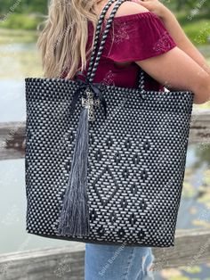 "These adorable tote bags are are high quality, made from recycled plastic and are easy to clean! The recycled plastic is woven together by hand by Mexican Artisans in Guadalajara, Mexico. This bag is big enough to fit all of your needs and looks adorable too! Measurements: 15\" x 16\"" Black Woven Tote Bag, Mexican Bag, Recycled Plastic Bags, Bag With Tassel, Embroidered Belt, Beautiful Belts, T Lights, Leather Slip On Shoes, Leather Slip Ons