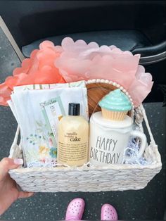 a person holding a basket filled with personal care items