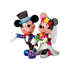 mickey and minnie mouse wedding figurines are dressed in colorful attire, with one holding the bride's hand