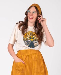 Keep on travelin' to ease your groovy soul. This Long Strange Trip Tee will open up your mind to new adventures with its desert scene image and the text: What A Long Strange Trip It's Been. Keep on truckin' thru your long strange trip of life in the cool tee! Natural. Hippie Headband, Hippie Headbands, Hippie Skirt, Pineapple Express, Star And Moon Necklace, Desert Scene, Hippie Skirts, Travel Tees, Recycled T Shirts