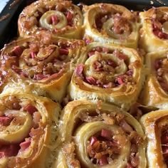 a pan filled with pastries covered in toppings