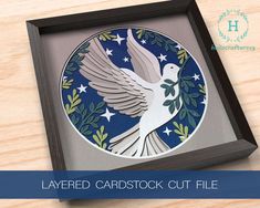 an image of a paper cut bird in a frame