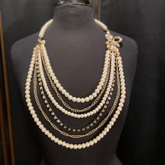 Layered Pearl Gold Chain Rhinestone Necklace Beautiful statement piece Perfect for any outfit Rhinestone Floral accent Length: 20.5 inches Party Pearl Beaded Chain Necklace, Elegant Layered Metal Necklace With Beaded Chain, Elegant Metal Layered Necklace With Beaded Chain, Elegant Beaded Chain Layered Necklace, Elegant Layered Beaded Chain Necklace, Pearl Multi-strand Necklace For Parties, Elegant Beaded Metal Layered Necklace, Pearl Beaded Necklaces With Chain For Party, Elegant Crystal Necklace With Pearl Chain