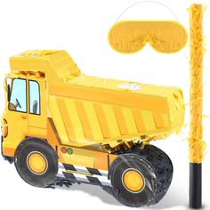 a yellow dump truck next to a pole