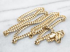 This bold 14-karat yellow gold chain is made up of oval, light-reflecting links, and finished with a lobster-ring clasp. Ready to wear alone or with a pendant, this is a great piece for layering!Metal: 14K Yellow GoldWidth of Chain: 3.9 mmLength of Chain: 24 InchesMarks: "14Kt ITALY" stamped on the clasp Yellow Gold Chain, Link Chain, Gold Chain, 404 Not Found, Ready To Wear, Yellow Gold, Chain, Pendant, Yellow