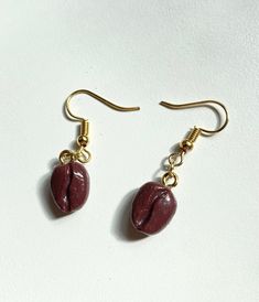 Coffee bean earrings with gold coloured links. The beads are handmade with polymer clay and glazed with resin. Perfect for barista's, coffee lovers etc !! Bean Earrings, Coffee Bean Earrings, Coffee Bean, Coffee Lovers, Coffee Beans, Favorite Things Gift, Wedding Shop, Coffee Lover, Jewelry Earrings Dangle