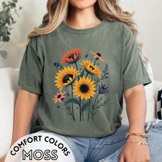 Celebrate the beauty of nature with this Botanical Shirt, featuring the iconic sunflower. Perfect for plant moms, gardeners, and nature lovers, this shirt brings a bright and cheerful touch to any wardrobe. It also makes a thoughtful gift for anyone who appreciates sunflowers and the outdoors. *Features a bold sunflower design *Ideal for plant lovers and gardening enthusiasts *Comfortable and stylish for everyday wear *Great gift for nature lovers *Perfect for casual outings or gardening days 🌟 Botanical Shirt, Comfort Colors Tshirt, Flower Shirt, Flower Lover, Floral Shirt, T Shirt Dress, Comfort Colors, Womens Shirts, Graphic Tees