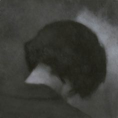 a black and white photo of a person's head with hair blowing in the wind