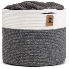 the grey and white basket has a tag on it