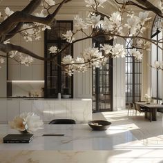 an elegant living room with large white flowers on the tree