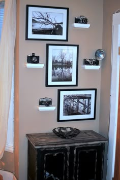 the wall is decorated with black and white photos, pictures, and other things on it