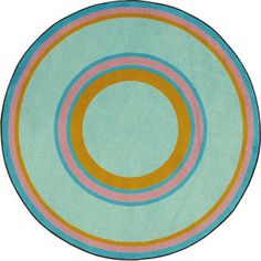 a round rug with an orange and blue circle on the center in front of a white background