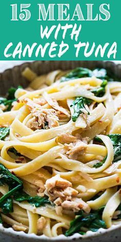 pasta with spinach, chicken and sauce in a bowl on top of a table