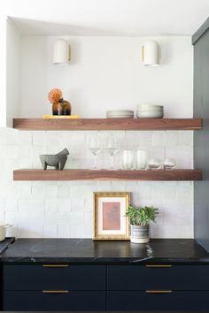 the kitchen counter is clean and ready to be used as a place for wine glasses