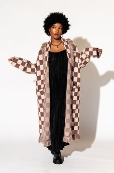 Lala Original Designs are thoughtfully designed in-house. These clothes were made for you. - Luxurious oversized blanket cardigan- Checker pattern in shades of tan- Fringe all down the collar & hem- Stretchy, thick, plush knit- Ultra soft material- Duster length Sabrina is 5'7", typically wears a size 2, and is wearing a S/M. Sierra is 5'8", typically wears a size 8 and is wearing a S/M.50% viscose 30% polyester 20% nylon © Dressed in LALA™ 2024 // Design owned and created by Dressed in LALA™ Oversized Beige Shawl Collar Outerwear, Oversized Brown Cardigan For Loungewear, Oversized Brown Outerwear For Loungewear, Brown Long Outerwear For Loungewear, Long Brown Outerwear For Loungewear, Satin Playsuit, Fringe Blanket, Blanket Cardigan, Checker Pattern