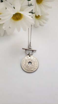 This Danish coin is unique and beautiful in design and size and makes a striking pendant. Celebrate your Scandinavian pride by gifting this necklace to your special someone. It features a silver 5 or 2-kroner coin hanging from an 18" stainless steel chain with a front toggle clasp. The 5-kroner coin is 1" in diameter and the 2-kroner coin is 7/8". Please note: the year on the coin may vary from the photographs, depending upon availability. If the year is important to you, please message me. Welc Birthday Gift For Girlfriend, Silver Coin Necklace, Scandinavian Jewelry, Heritage Jewellery, Coin Pendant Necklace, Watch Parts, Jewelry Birthday, Silver Coin, Old Jewelry