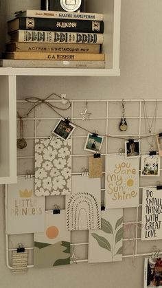 a white shelf filled with lots of pictures and magnets on top of each other