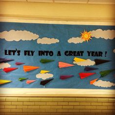 a bulletin board that says let's fly into a great year