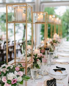 a long table with candles and flowers on it