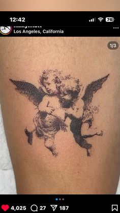 a tattoo with an angel on it and two cherubs in the center, surrounded by angels