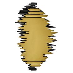 a mirror that has some black and gold shapes on it's sides, with one light in the middle