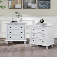 two white dressers sitting next to each other on top of a carpeted floor