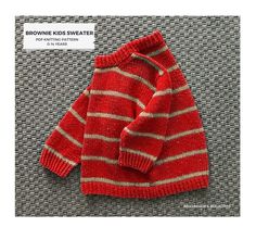 a red and white striped sweater sitting on top of a gray carpet next to a sign that says brownie kids sweaters for knitting pattern