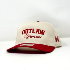 Introducing the 'Outlaw Woman Trucker Hat,' the perfect accessory for women who want to make a statement. This trucker hat is made to last, designed with high-quality materials that can endure any outdoor adventure. The hat features a classic trucker style with a curved brim and adjustable snapback closure, making it comfortable and easy to wear. The black mesh backing ensures ample ventilation, keeping you cool even on hot summer days.The front of the hat boasts an embroidered design of an outlaw woman on horseback, flaunting her fearless spirit and free-spirited nature. The contrasting white stitching adds an extra pop of style.Whether you're hitting the trails or running errands around town, this 'Outlaw Woman Trucker Hat' will elevate your outfit while protecting your face from harmful Cowgirl Trucker Hat, Women Trucker Hat, Western Trucker Hat, Embroidered Trucker Hats, Woman On Horseback, Trendy Trucker Hats, Red Trucker Hat, Outlaw Women, Funny Trucker Hat