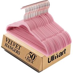 pink velvet hangers in a cardboard box with 50 packs of them on the top